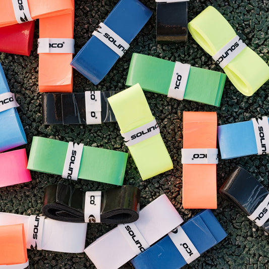 Diferentes Overgrip Solinco Wonder Grip em Branco, Preto, Verde, Amarelo e Vermelho.